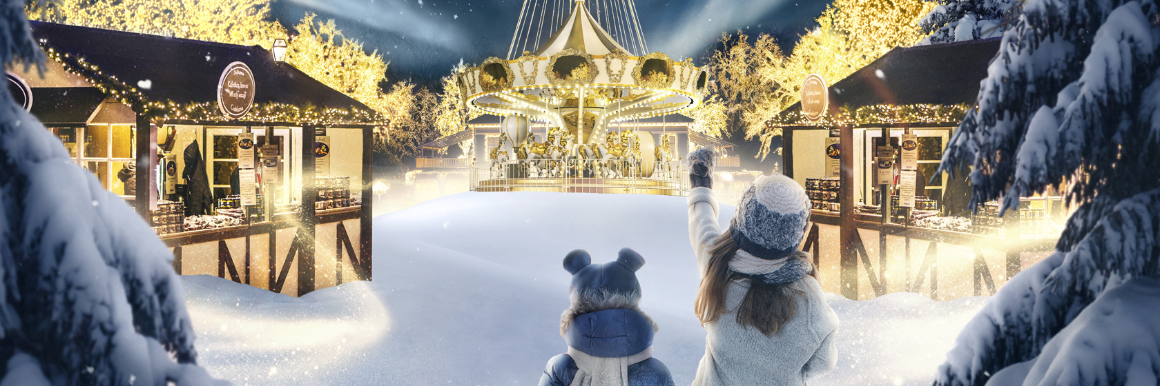 Jul p Liseberg, upplysta karuelseer och marknadsstnd.